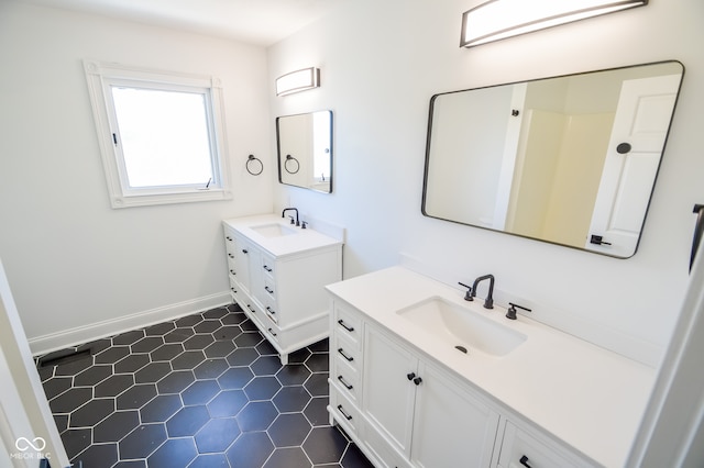 bathroom featuring tile patterned flooring and vanity