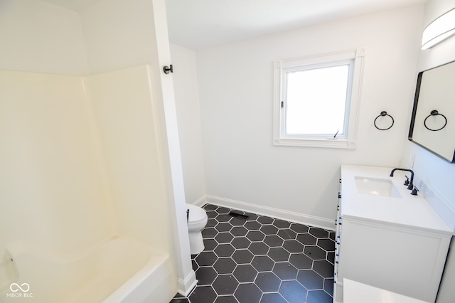 full bathroom with tile patterned flooring, toilet, plus walk in shower, and vanity