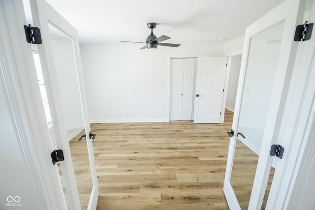 spare room featuring ceiling fan and light hardwood / wood-style floors