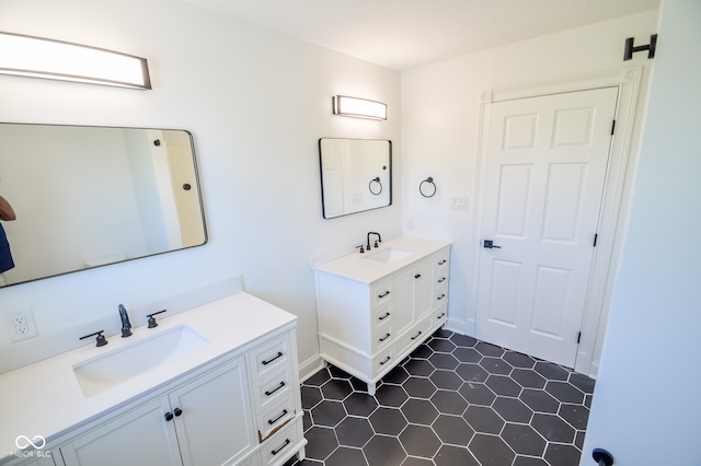 bathroom featuring tile patterned flooring and vanity