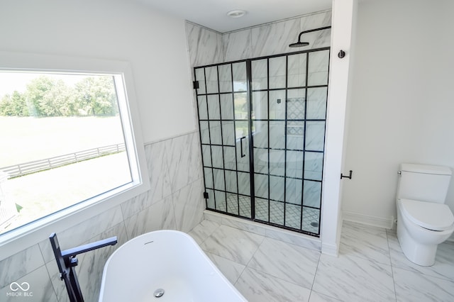 bathroom featuring plus walk in shower, toilet, tile patterned flooring, and tile walls