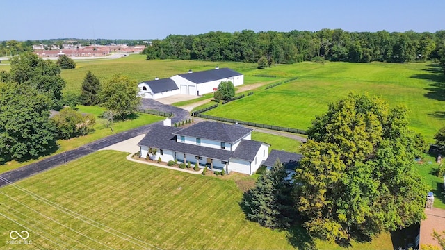 birds eye view of property with a rural view