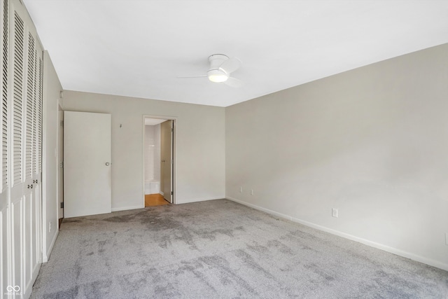 unfurnished bedroom with ceiling fan and light colored carpet