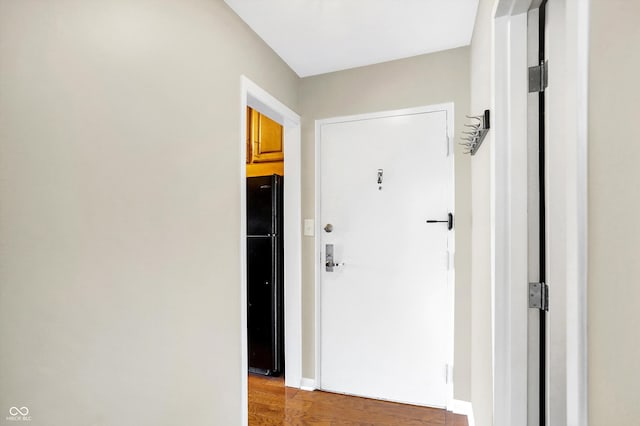 corridor featuring hardwood / wood-style flooring