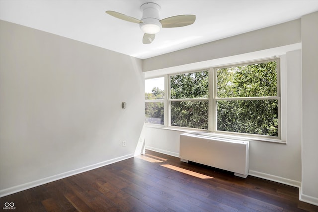 unfurnished room featuring hardwood / wood-style flooring, a healthy amount of sunlight, and ceiling fan