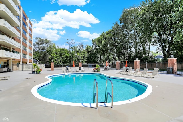 view of swimming pool with a patio