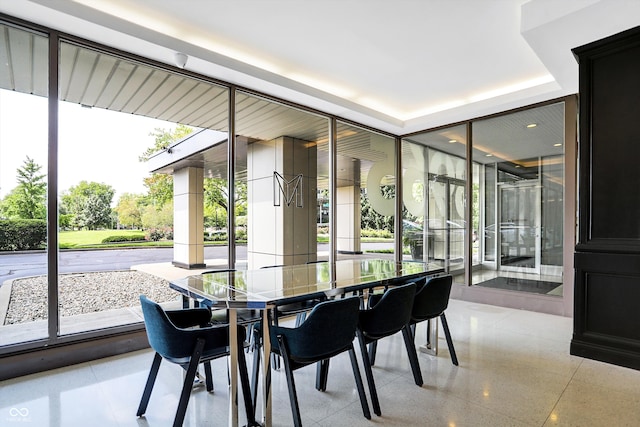 dining space with a healthy amount of sunlight and light tile patterned floors