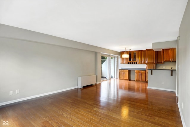 unfurnished living room featuring hardwood / wood-style floors