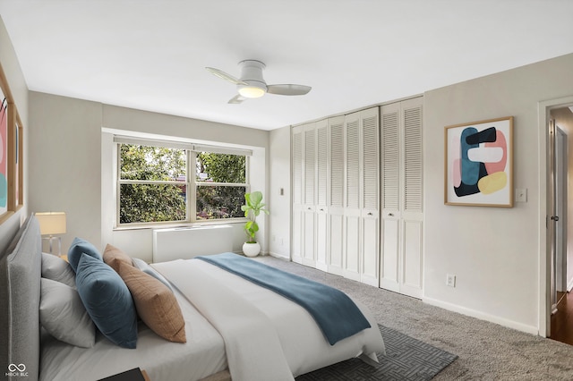 carpeted bedroom with ceiling fan and a closet