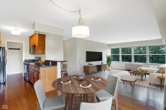 dining room with dark hardwood / wood-style floors