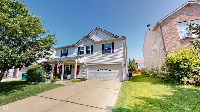 view of property featuring a garage, a porch, and a front lawn