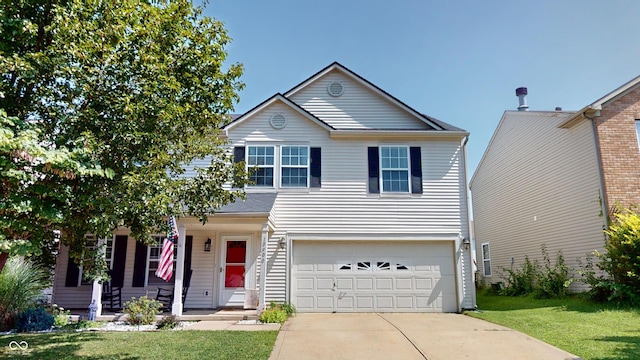 view of front of house featuring a garage and a front lawn