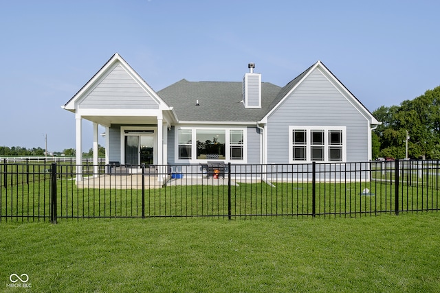 back of house featuring a yard