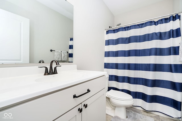 bathroom with a shower with curtain, vanity, and toilet