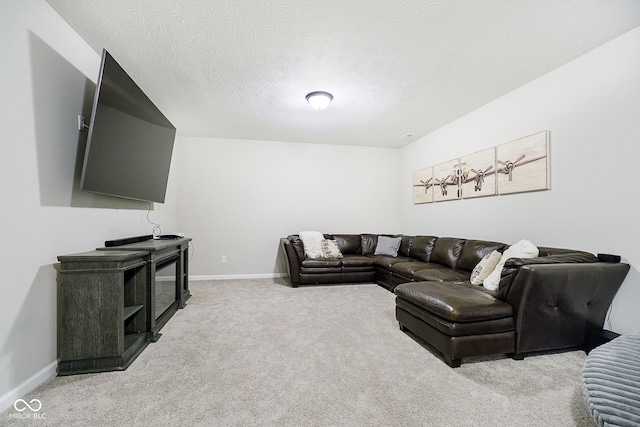 living room featuring light colored carpet and a textured ceiling