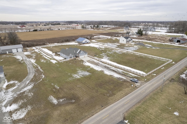 snowy aerial view with a rural view