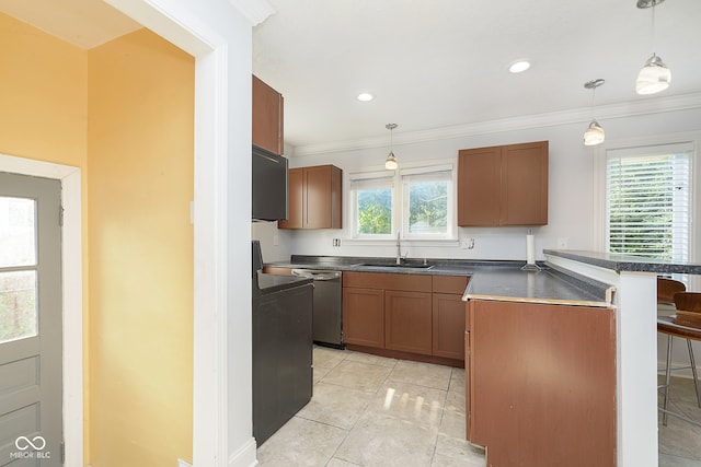 kitchen with pendant lighting, crown molding, sink, a breakfast bar, and stainless steel dishwasher