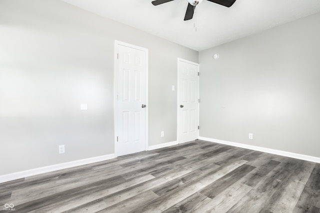 spare room with ceiling fan and hardwood / wood-style floors