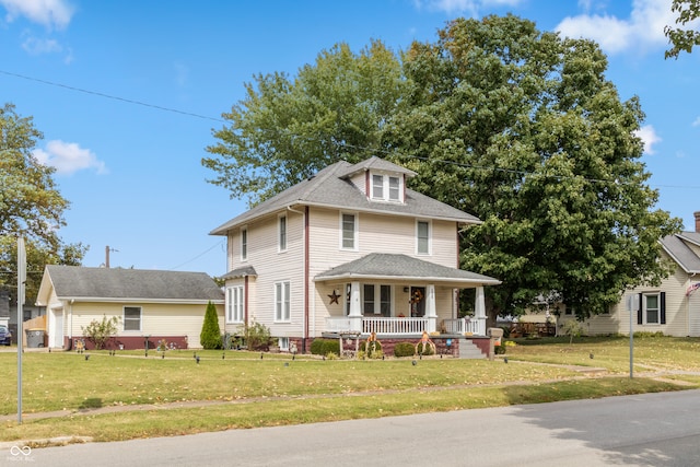 view of front of home featuring a front lawn and covered porch