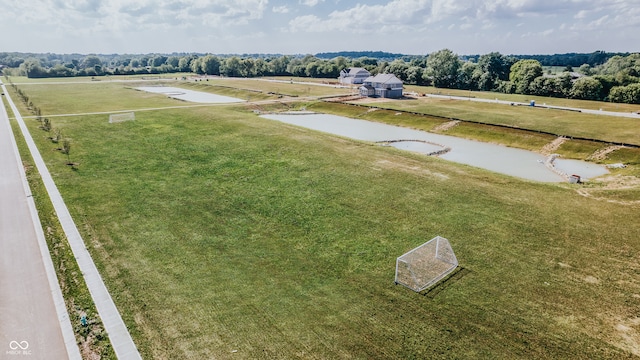 birds eye view of property with a rural view