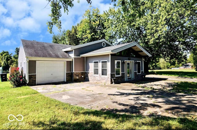 view of front of property featuring a garage and a front yard