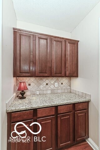 14626 Warner Trl, Westfield, IN 46074 - kitchen featuring decorative backsplash, wood finished floors, and light stone countertops