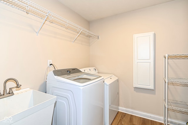 14626 Warner Trl, Westfield, IN 46074 - laundry room with separate washer and dryer, wood finished floors, and baseboards