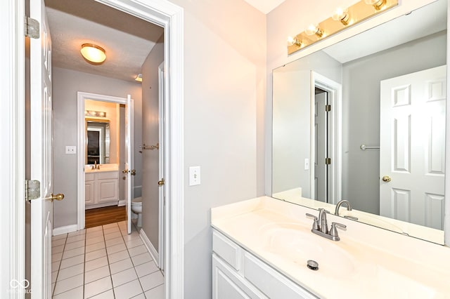 14626 Warner Trl, Westfield, IN 46074 - bathroom with tile patterned flooring, vanity, toilet, and baseboards