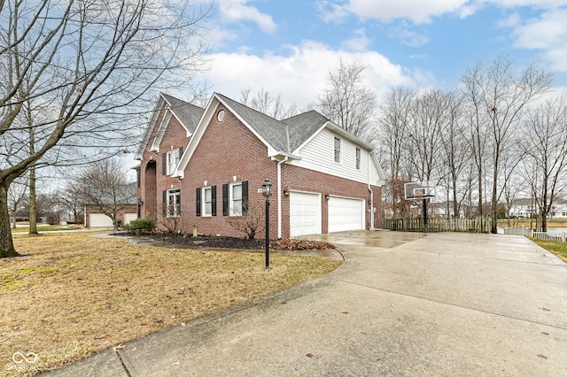 14626 Warner Trl, Westfield, IN 46074 - view of side of property featuring brick siding, concrete driveway, and an attached garage