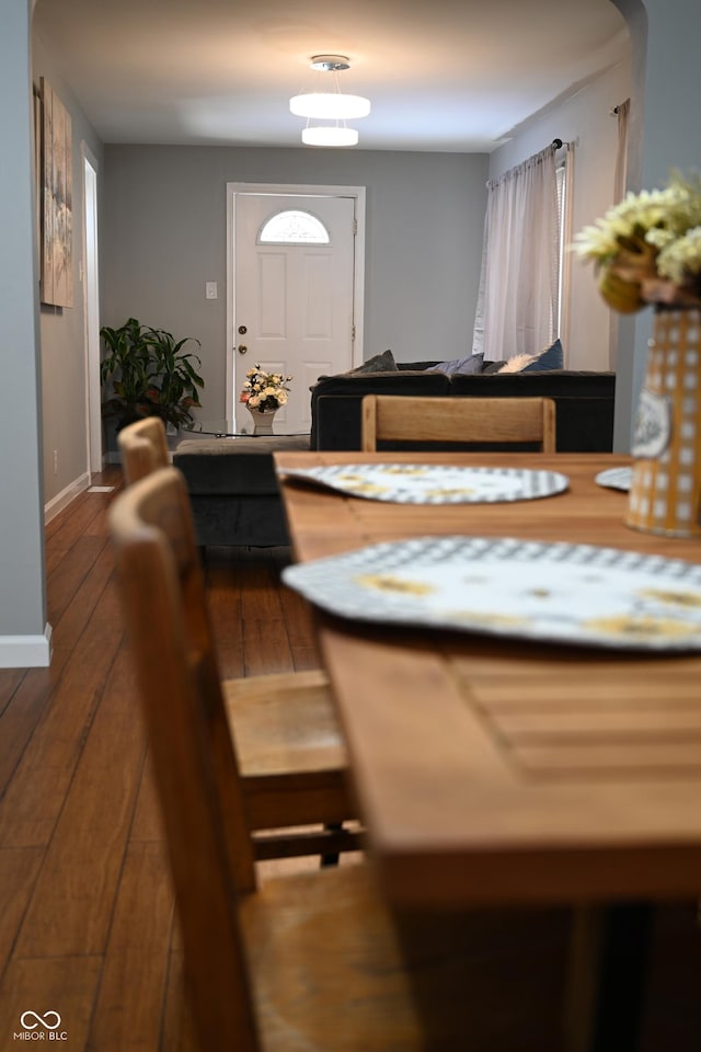 interior space featuring baseboards and wood finished floors