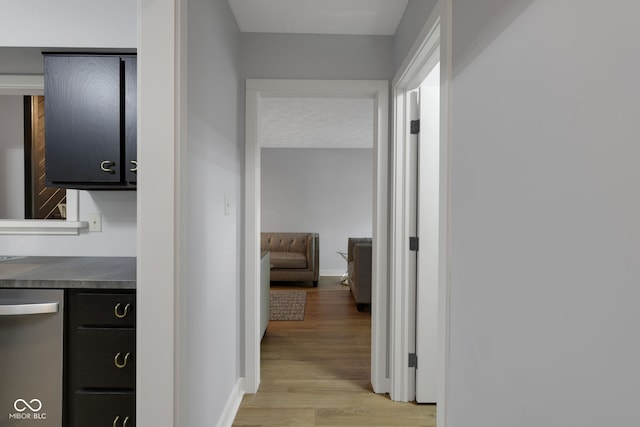 hall with light hardwood / wood-style flooring