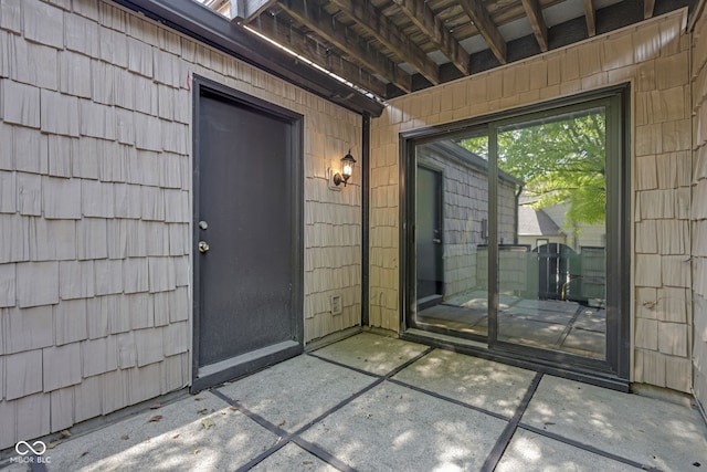 property entrance with a patio area