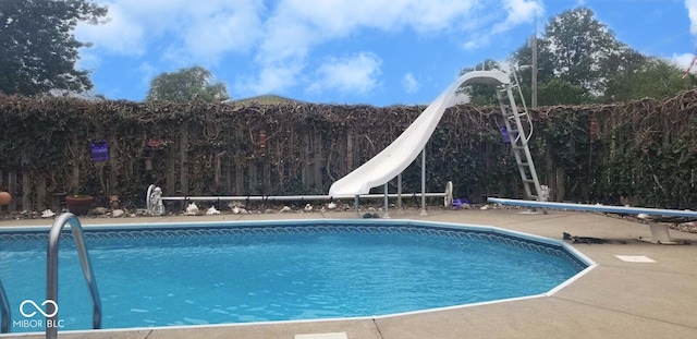 view of pool featuring a water slide