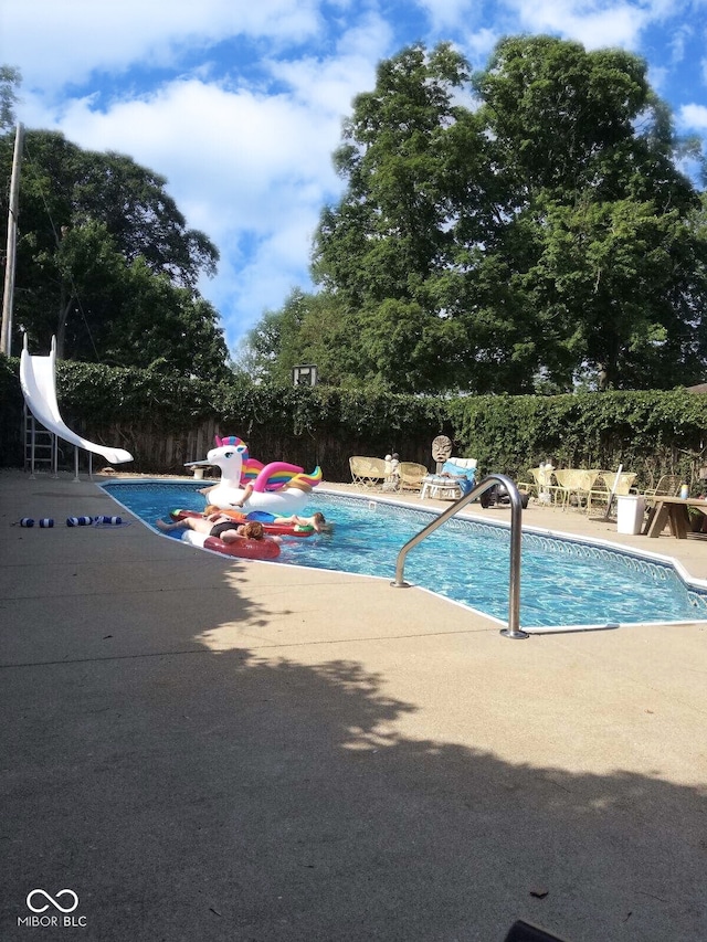 view of pool featuring a patio area