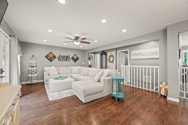 living room featuring ceiling fan and hardwood / wood-style floors