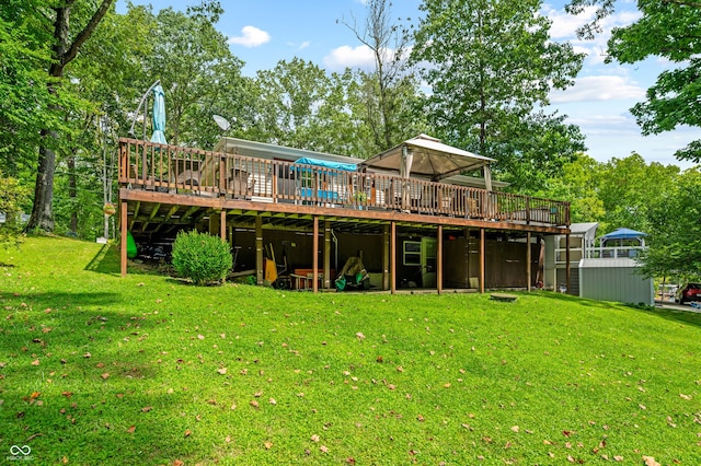 back of house with a lawn and a deck