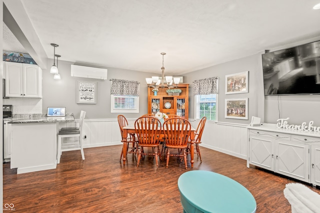 dining room featuring dark hardwood / wood-style floors, a wall mounted air conditioner, and a chandelier