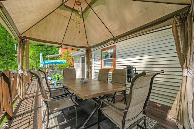 wooden deck featuring a gazebo