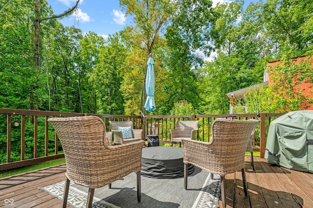 wooden deck with grilling area