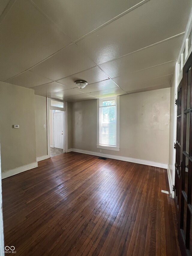 spare room featuring dark hardwood / wood-style floors