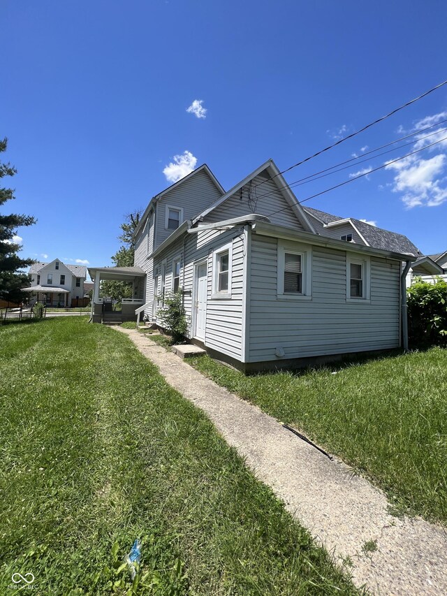 view of property exterior with a yard