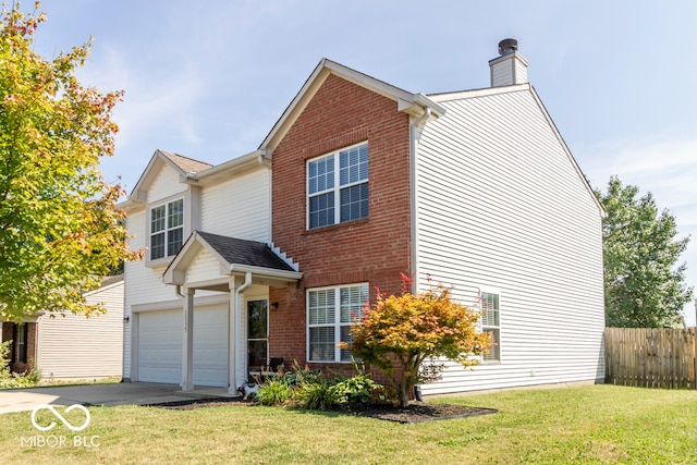 view of front of property featuring a garage and a front lawn