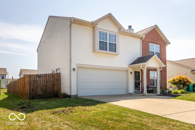 view of front of house featuring a garage and a front yard