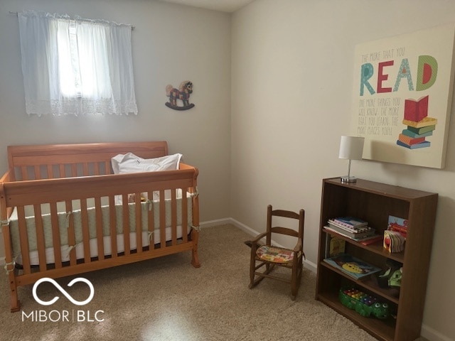 bedroom with a nursery area