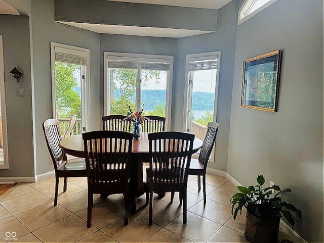 dining area with light tile patterned flooring