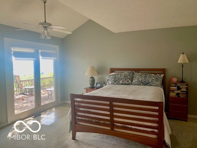 carpeted bedroom featuring lofted ceiling, access to exterior, and ceiling fan