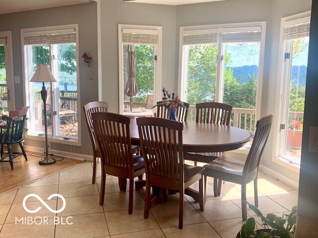 dining space with a healthy amount of sunlight and light tile patterned floors