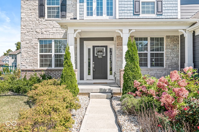 doorway to property with covered porch