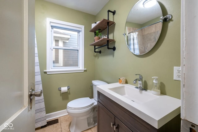 bathroom with tile patterned flooring, curtained shower, vanity, and toilet