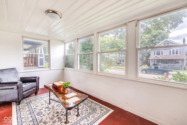 sunroom / solarium featuring a healthy amount of sunlight